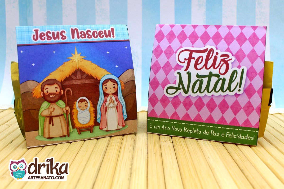 Dois porta-bombons lado a lado: um com o presépio e outro com mensagem de Feliz Natal.