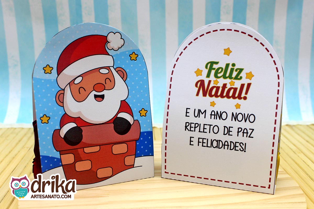 Porta-bombom de Papai Noel na chaminé e seu verso com mensagem "Feliz Natal!" e votos de paz e felicidades